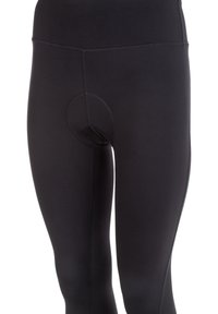 Black leggings made of stretchy fabric, featuring a high waistband, seamless design, and a circular stitched detail at the front.