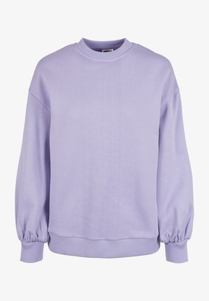 Gaiši violetā džemperis, ar apaļu kakla izgriezumu, ar ribotām piedurknēm un apakšmalu. Mīksta auduma, ar brīvu piegriezumu un nedaudz puffētām piedurknēm.