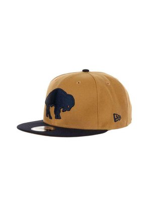 Brown and navy baseball cap made of fabric, featuring a blue buffalo logo on the front and a flat brim. Black underside of brim.