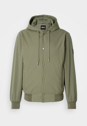 Olive green hooded jacket with front snap buttons, drawstring hood, ribbed cuffs, hem, side pockets, and BOSS logo label inside collar and sleeve.
