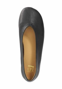 Black leather ballet flat featuring a rounded toe, central seam, and a cutout detail at the sides. Interior has a tan cushioned lining.