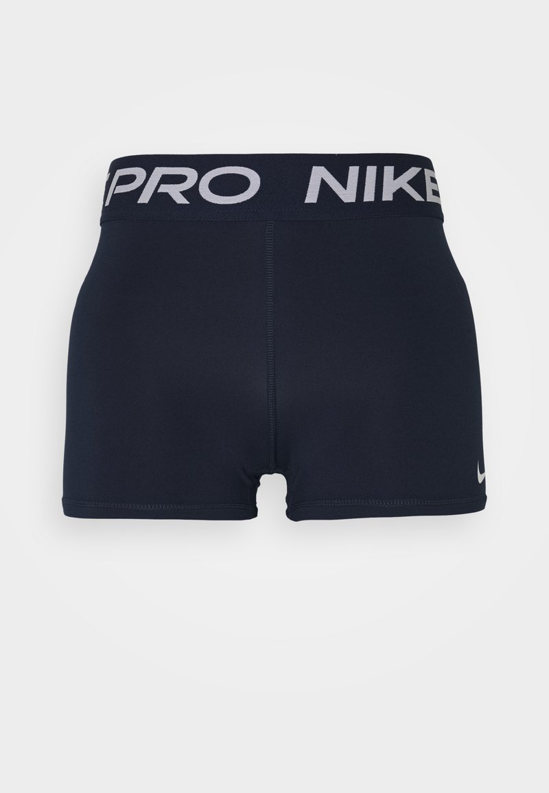 Pantalones cortos deportivos de color azul marino con una cinturilla negra ancha que presenta "PRO" y "NIKE" en texto blanco. Tela suave y elástica con un ajuste ceñido.