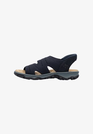 Navy blue sandal with open toe, multiple fabric straps across the foot, and a cushioned tan insole. Features a textured black outsole.