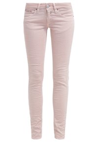 Light pink skinny jeans made of denim, featuring a classic five-pocket design, button closure, and subtle wrinkled texture.
