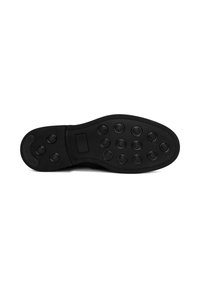 Semelle de chaussure noire présentant des motifs de grip circulaires, une texture lisse et une forme légèrement courbée. Couture élégante le long des bords.