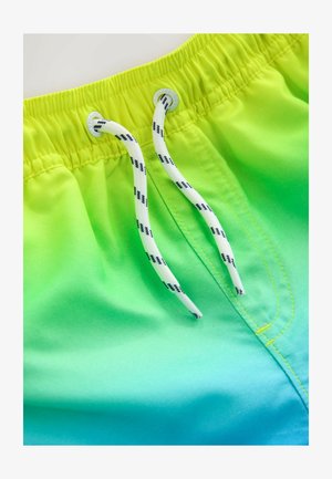 Zwemshorts met groene gradient, voorzien van een elastische tailleband met een witte trekkoord en decoratieve gele stiksels. Glad stoftextuur.