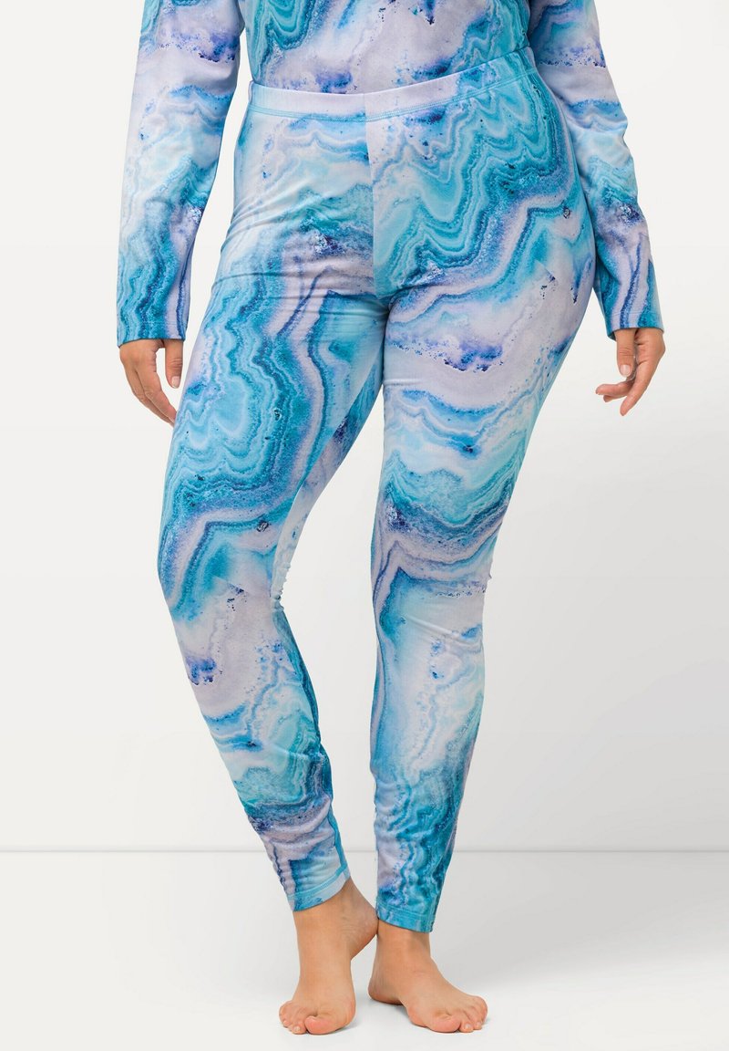 Leggings blu e turchesi con un motivo marmorizzato a spirale. Tessuto morbido e elasticizzato con una consistenza liscia e un design aderente.