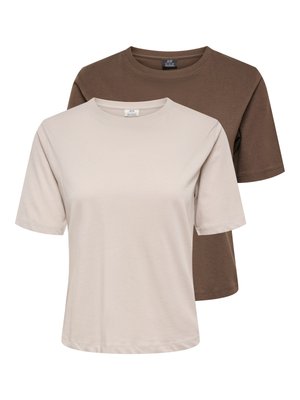 Woman walking in brown short-sleeve top, white knee-length skirt, brown heeled sandals, and carrying small brown shoulder bag.