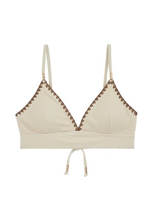 Bralette de textura cremosa con tirantes delgados ajustables, ribete marrón en zigzag a lo largo de los bordes superiores y un lazo frontal con puntas en tono dorado.