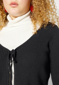 Vero Moda Curve GOLD CURVE - Casaco de malha - black