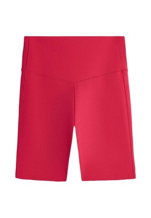 Short de vélo rouge taille haute avec une couture avant en forme de V et un tissu lisse et extensible s’étendant jusqu’à mi-cuisse.