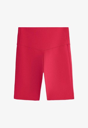 Short de vélo rouge taille haute avec une couture avant en forme de V et un tissu lisse et extensible s’étendant jusqu’à mi-cuisse.