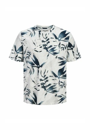 T-shirt blanc à manches courtes avec un motif abstrait de feuilles tropicales en bleu foncé et noir, avec un col rond.