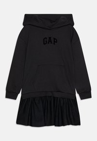Juoda su gobtuvu ir raukšlėta apačia, su dideliu juodu "GAP" logotipu priekyje ir platėjančia satino sijonu.
