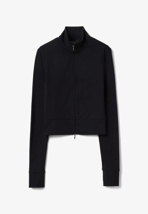 Veste courte noire à manches longues avec col montant et fermeture éclair frontale, présentée sur un fond blanc.