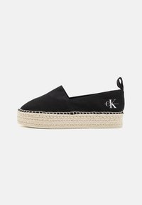 Černé plátěné espadrilky s tlustou tkanou jutovou podrážkou, s plochým designem a malým podpatkem, zdobené logem Calvin Klein.