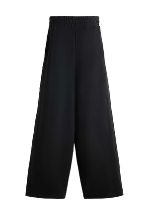 Schwarze weit geschnittene Hosen aus einem glatten Material mit einem elastischen Bund. Mit Druckknopf-Akzenten an der Seite für eine anpassbare Passform.