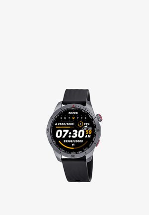 Smartwatch z czarnym paskiem pokazujący godzinę 07:30, datę 20 lutego, poziom baterii 75%, liczbę kroków oraz postęp dziennej aktywności na okrągłym ekranie cyfrowym.