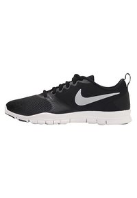 Scarpe da ginnastica nere realizzate in rete e materiale sintetico. Presentano un logo Nike bianco, un upper texturizzato e una suola in gomma bianca flessibile.