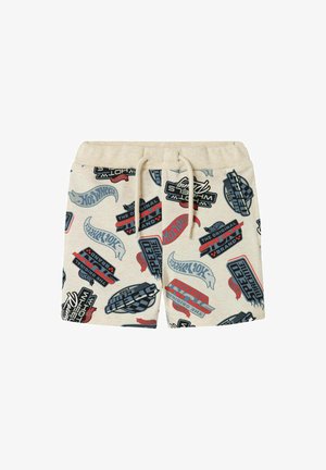 Shorts beige ornés d'un motif ludique de graphismes colorés Hot Wheels, incluant des logos et des designs de course. Taille avec cordon de serrage, coupe décontractée.