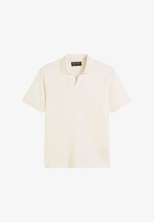 Crème polo shirt met korte mouwen en een klassieke kraag, gemaakt van zachte katoenstof. Heeft een rechte zoom en een minimalistisch label bij de hals.