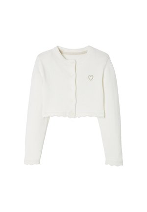 White cropped long-sleeve cardigan with round neck, button closure, scalloped edges, and small embroidered heart on the chest.