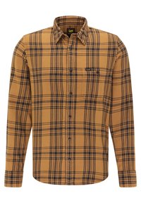 Camicia in flanella a quadri marrone e blu navy con colletto button-down, taschino sul petto e maniche lunghe. Realizzata in morbido cotone.