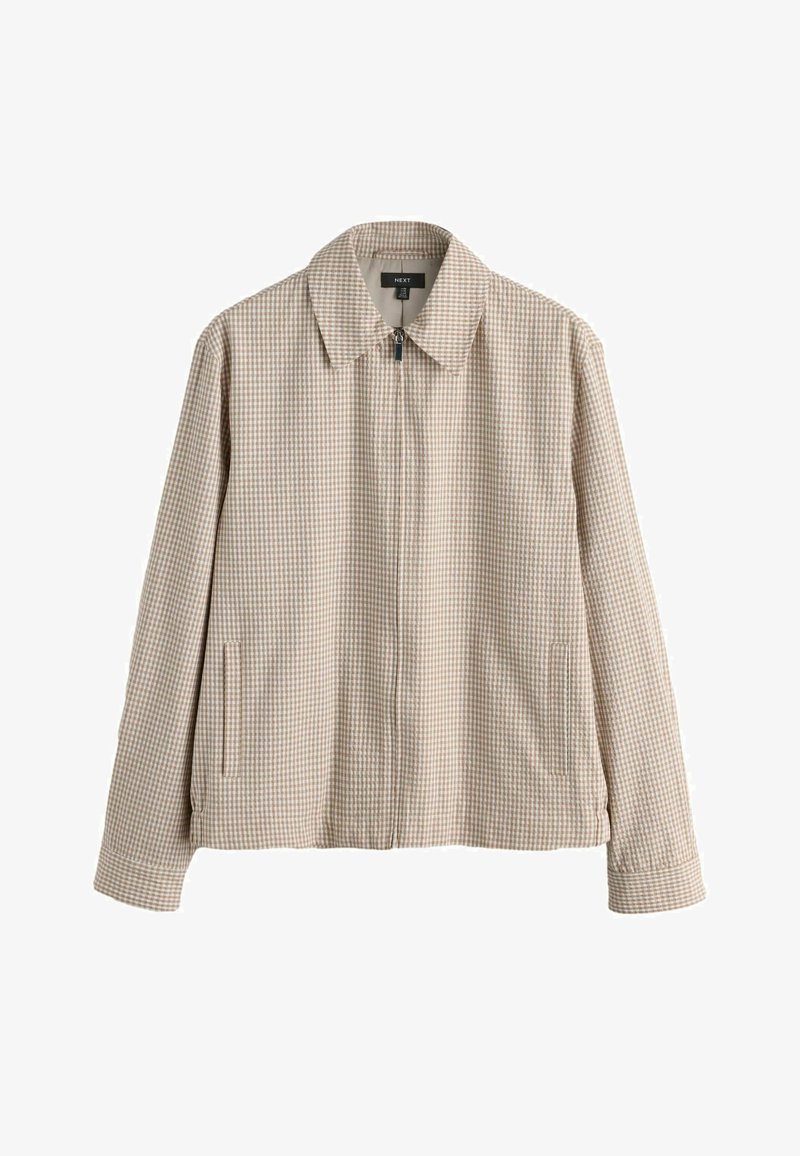 Veste zippée à petits carreaux beige et blancs avec col, poches latérales fendues, manches longues et ourlet droit.