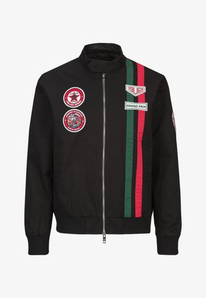 Schwarze Zip-up-Jacke mit grünen und roten Rennstreifen, Aufnäher mit der Aufschrift "Monza Italian Speed", "Grand Prix" und vintage Rennsport-Motiven.