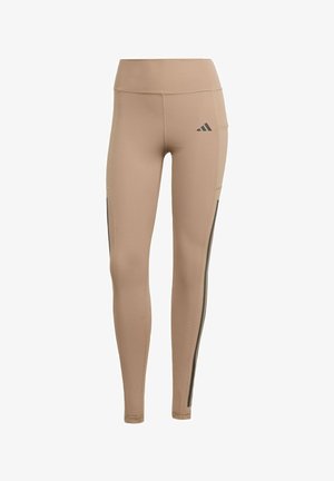 Beige athletic leggings with a high waist, made from stretch fabric. Features gray side stripes and a small black logo on the upper thigh.