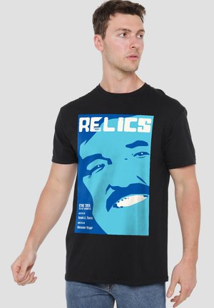 Black cotton T-shirt featuring a blue graphic print of a face with the text "RELICS" and details about "Star Trek: The Next Generation."