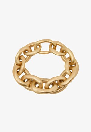 Pulsera de cadena gruesa de oro con grandes eslabones ovalados dispuestos en un patrón circular sobre un fondo blanco.