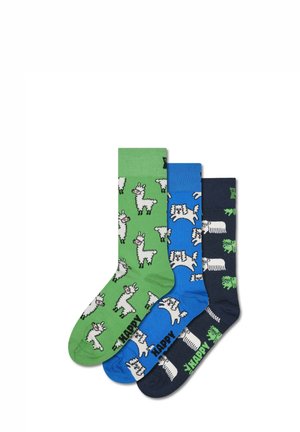 Three pairs of cotton socks: green with white llamas, blue with playful patterns, and navy with green accents, all featuring text.