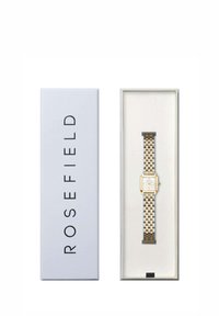 Montre bicolore en métal or et argent avec un cadran blanc carré, présentée dans une élégante boîte grise étiquetée "ROSEFIELD."
