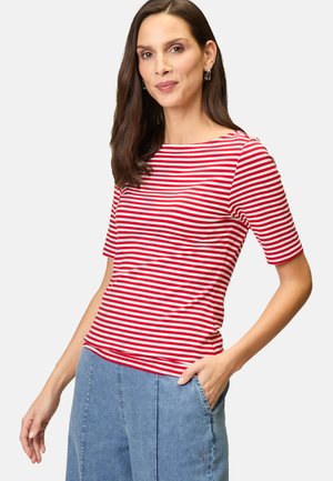 Red and white striped short-sleeve T-shirt with a round neckline, made from soft fabric, paired with light blue wide-leg jeans.
