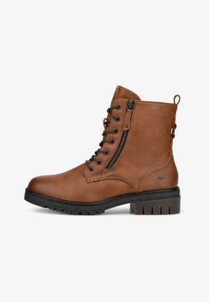 Brown leather ankle boot with a rounded toe, lace-up front, side zipper, textured rubber sole, and a small logo on the heel.