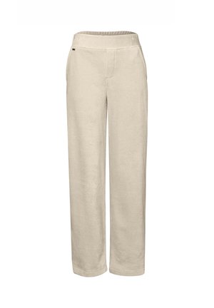 Pantalons larges beige en tissu doux, dotés d'une taille élastique et de deux poches avant. Texture lisse avec un design épuré.