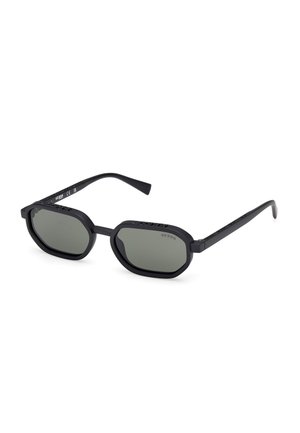 Black rectangular sunglasses with green lenses, matte finish, and subtle branding on the temples; features a unique octagonal shape.