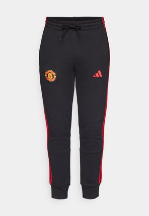 Mustat puvun housut, joissa on punaiset sivupinnat, varustettu brodeeratulla Manchester United -logolla ja Adidas-logolla reiden kohdalla. Säädettävä vyötärö.