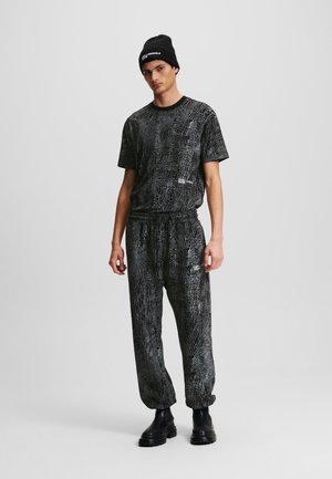 Karl Lagerfeld Jeans CRACKED PRINT SWEAT - Jogginghose - black all over crack print