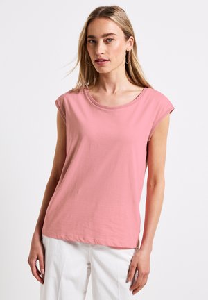 Top sans manches rose à coupe décontractée, fabriqué en coton doux, avec un col rond et des emmanchures roulées pour un look décontracté.