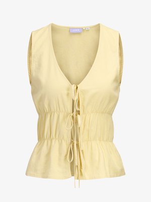 Αμάνικο ανοιχτό κίτρινο μπλουζάκι με βαθύ V-λαιμόκοψη, τρία μπροστινά κλεισίματα με κορδόνι, σφιχτή μέση και ελαφρώς φαρδύ τελείωμα.