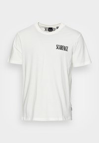 White cotton t-shirt with short sleeves and round neck. Features a black "SCARFACE" logo printed on the left chest area.