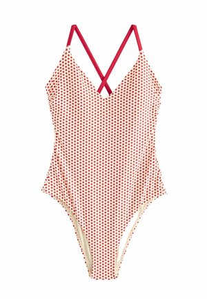 Einteiliger Badeanzug mit roten Punkten auf cremefarbenem Stoff und gekreuzten roten Trägern.
