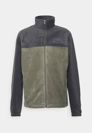 Veste en polaire gris foncé et vert olive avec un col haut, fermeture éclair et un détail logo sur la poitrine, comportant deux poches latérales.