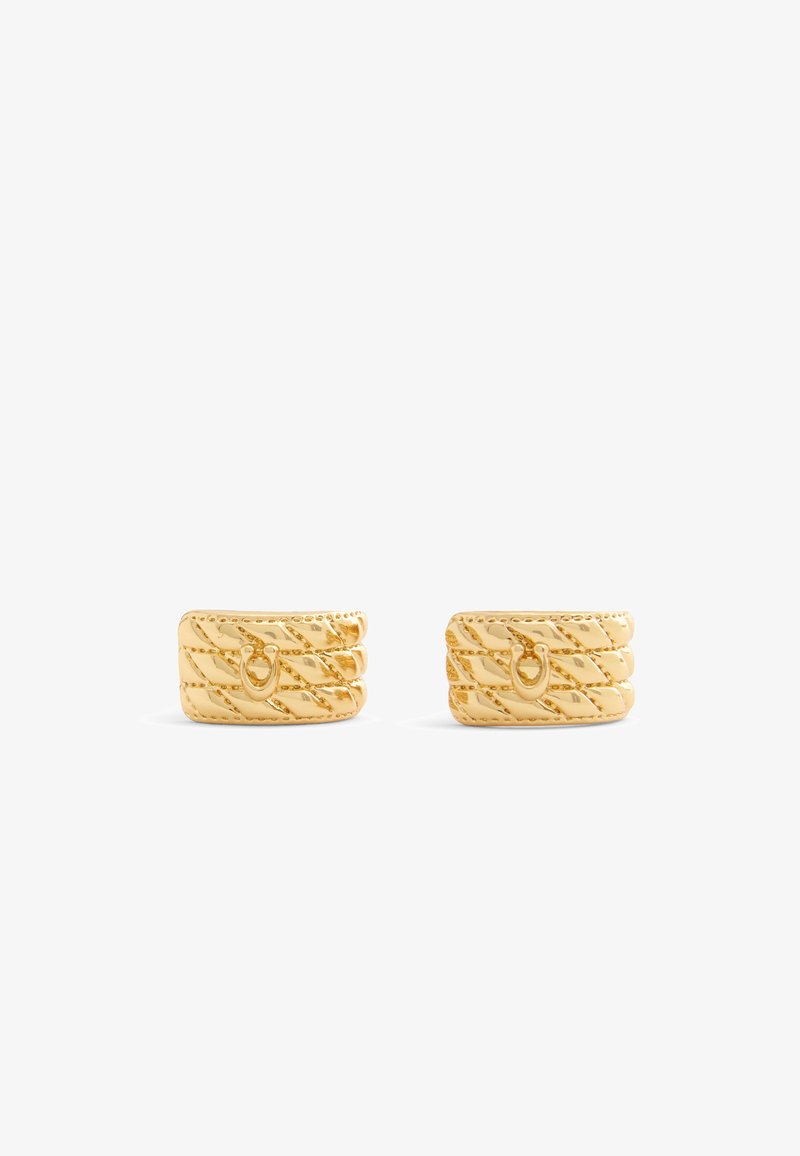 Gold ear cuffs with a textured, swirling design featuring diagonal lines and a small loop accent, finished in a polished shine.