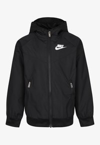 Svart Nike-hoodie med framdragskedja och dragkedjefickor på sidorna, elastiska manschetter och vitt Nike-logotyp på vänster bröst.