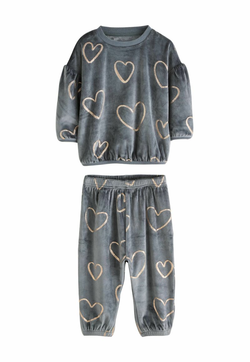 Velvet loungewear set featuring a gray top with puffed sleeves and gold heart patterns, paired with matching pants with elastic cuffs.