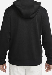 Svart huvtröja i en texturerad tyg, med en rymlig huva, ribbade ärmslut och en nederkant med ett subtilt zigzagmönster.