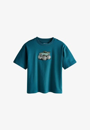 Detské tričko s krátkym rukávom v tyrkysovej farbe s grafikou zeleného monster trucku na hrudi, okrúhlym výstrihom a voľným strihom.